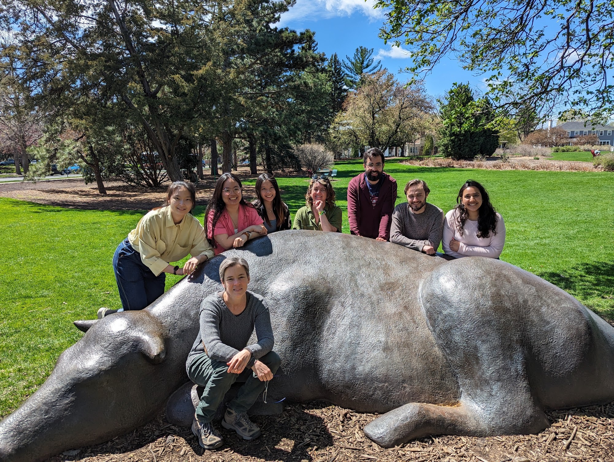 Lab members posing with sculpture on the St Paul Campus